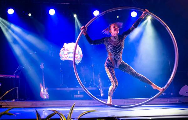 A performer on a cyr wheel entertains the crowd at Frooog’s Camp House on Hacienda, outside o ...