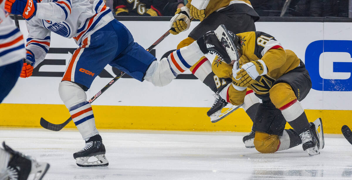 Golden Knights right wing Jonathan Marchessault (81) grabs his face as an Edmonton Oilers playe ...