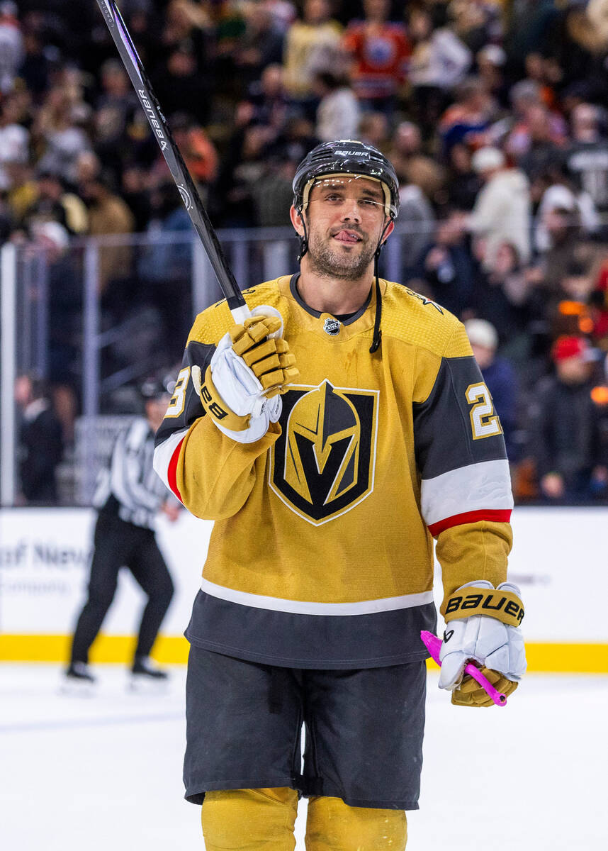 Golden Knights defenseman Alec Martinez (23) looks to the crowd after picking up a flamingo aft ...