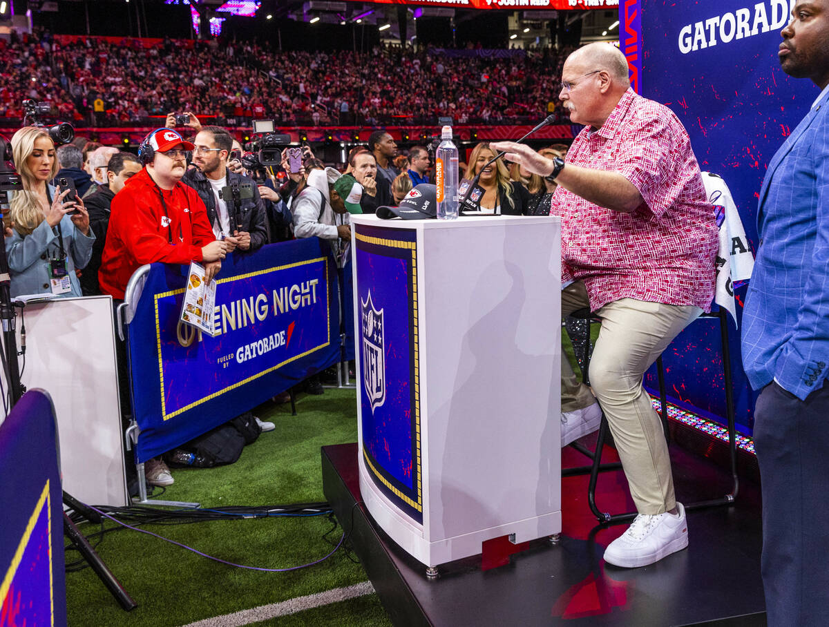 Kansas City Chiefs Head Coach Andy Reid answers a media member's question on the field during t ...