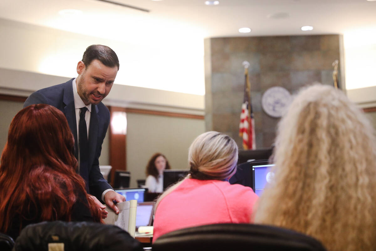 Attorney Eric Pepperman speaks with plaintiffs following a verdict in a lawsuit against Real Wa ...