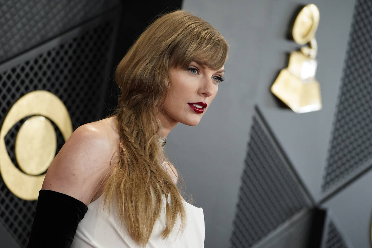 Taylor Swift arrives at the 66th annual Grammy Awards on Sunday, Feb. 4, 2024, in Los Angeles. ...