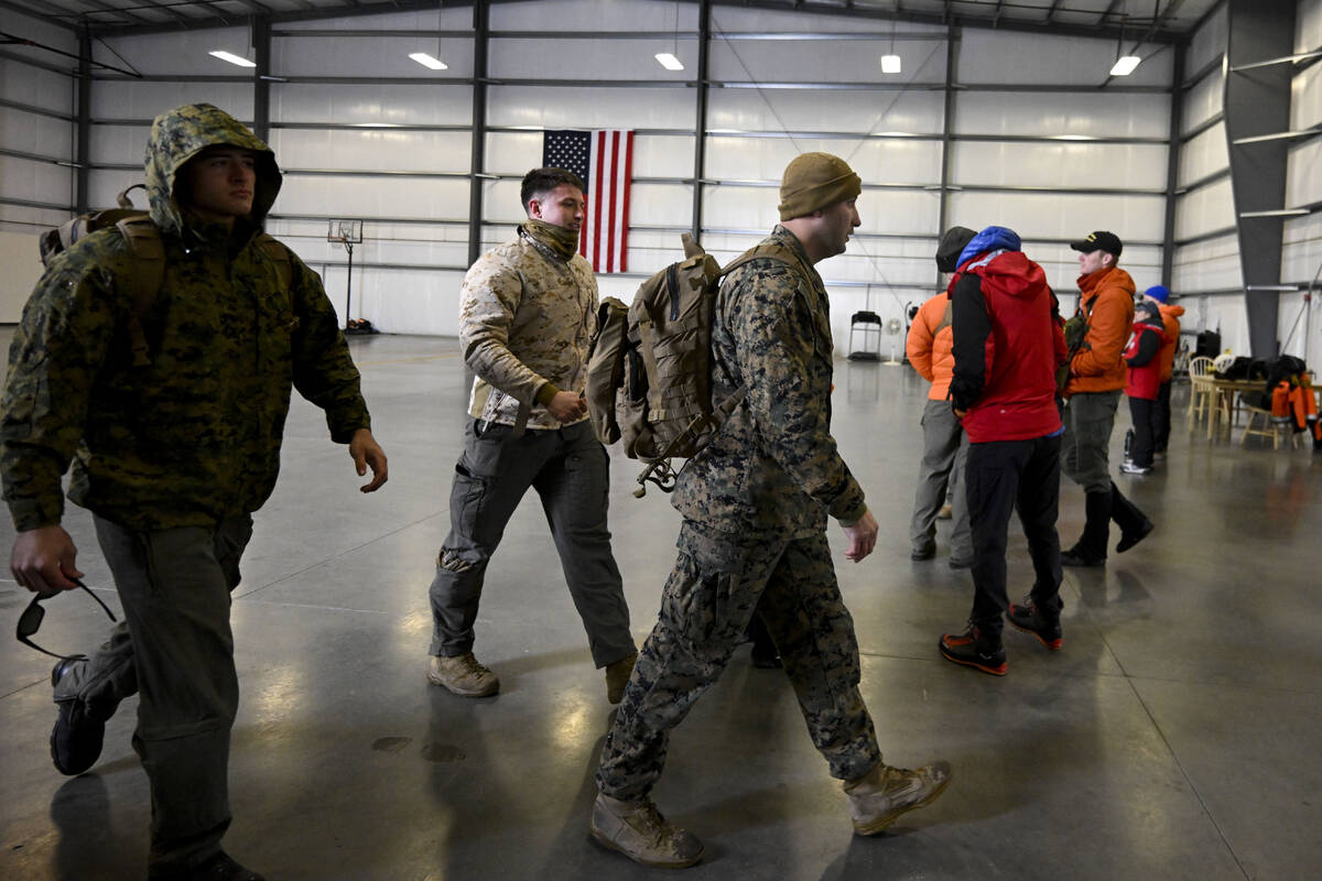 U.S. Marines leave a command center, Wednesday, Feb. 7, 2024, in Kitchen Creek, Calif. A Marine ...