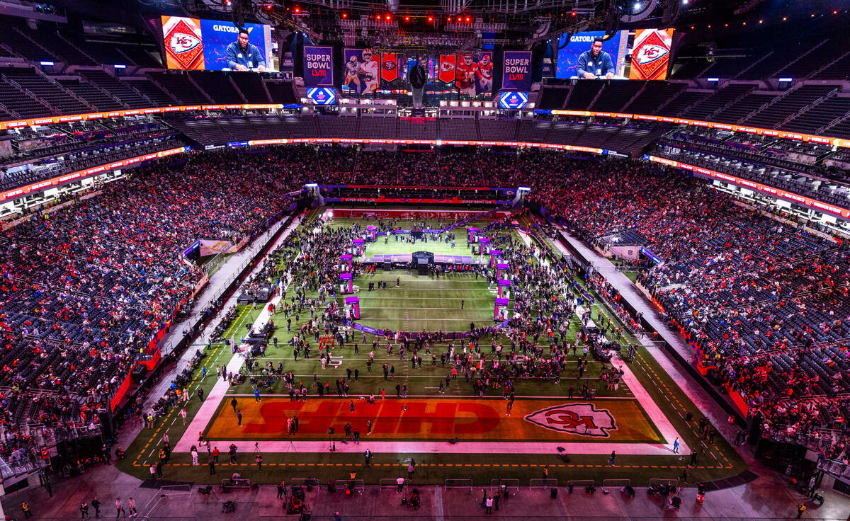 Fans, guests and media members fill the stands and field as Kansas City Chiefs players and coac ...