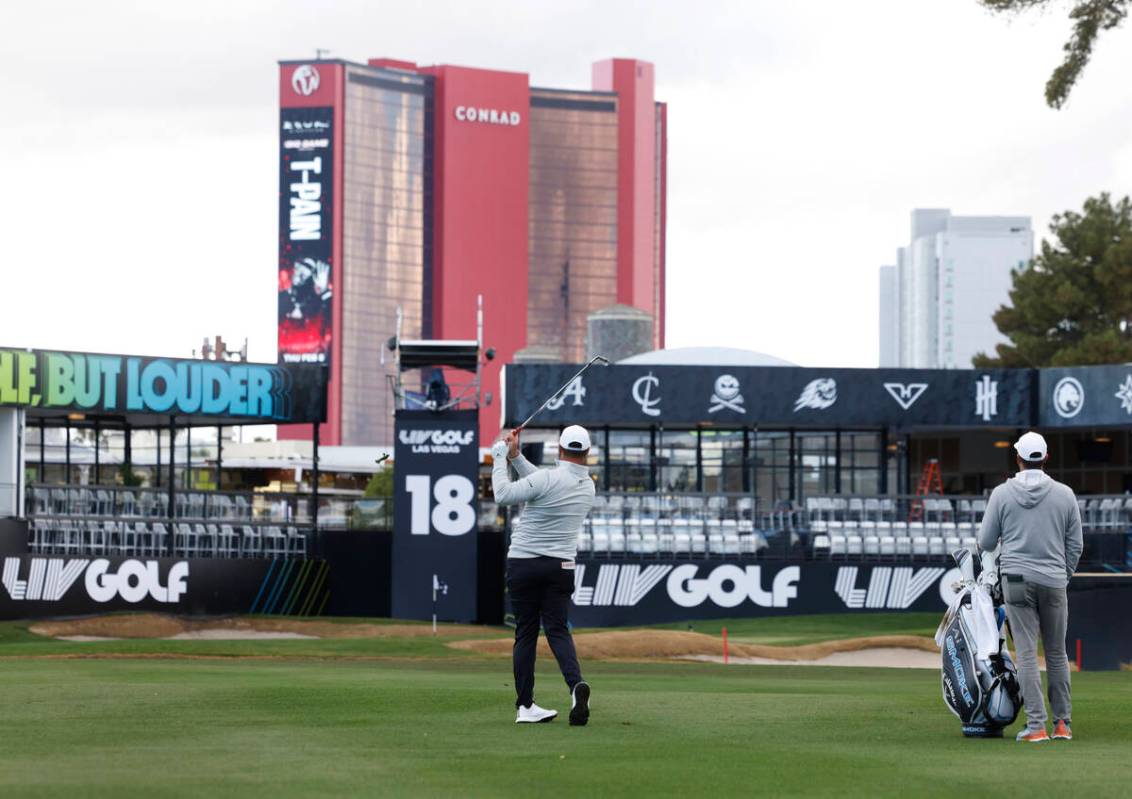 Jon Rahm watches after hitting onto the 18th green during LIV Golf Las Vegas Pro-Am tournament ...