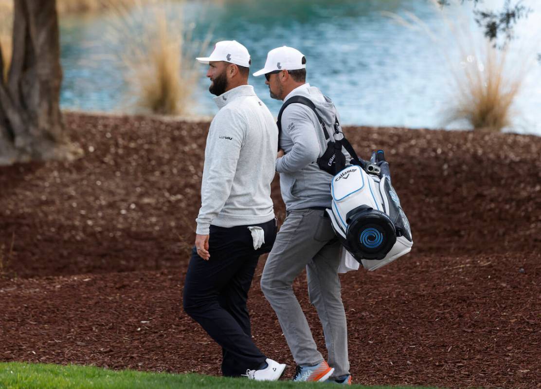 Jon Rahm, left, arrives at Las Vegas Country Club during LIV Golf Las Vegas Pro-Am tournament, ...