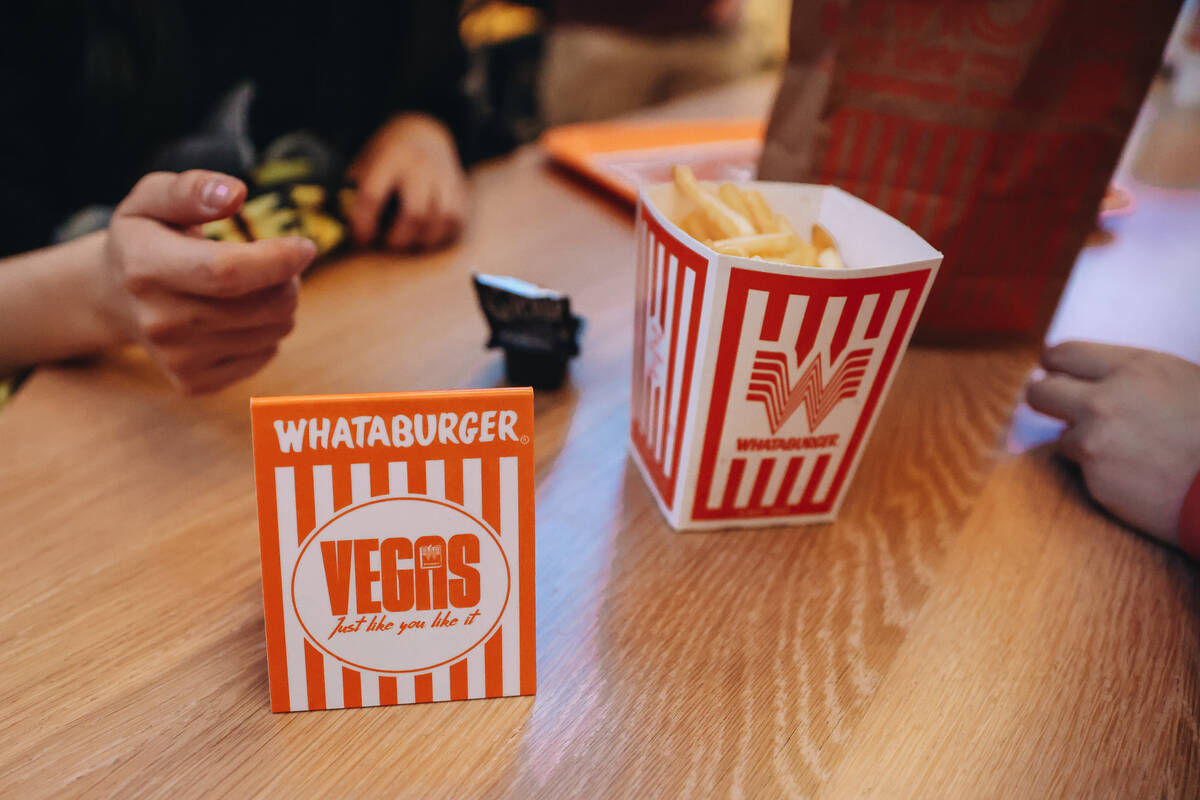 A Whataburger place card sits on a table at Whataburger on Wednesday, Feb. 7, 2024, in Las Vega ...