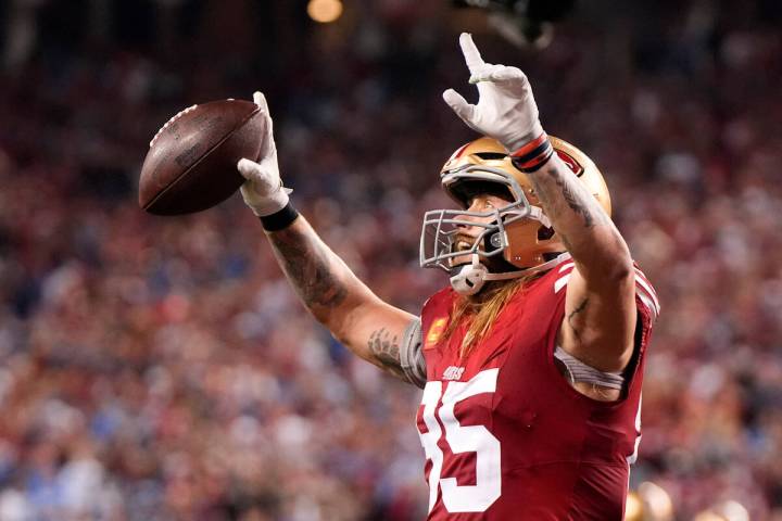 San Francisco 49ers tight end George Kittle celebrates after running back Elijah Mitchell score ...