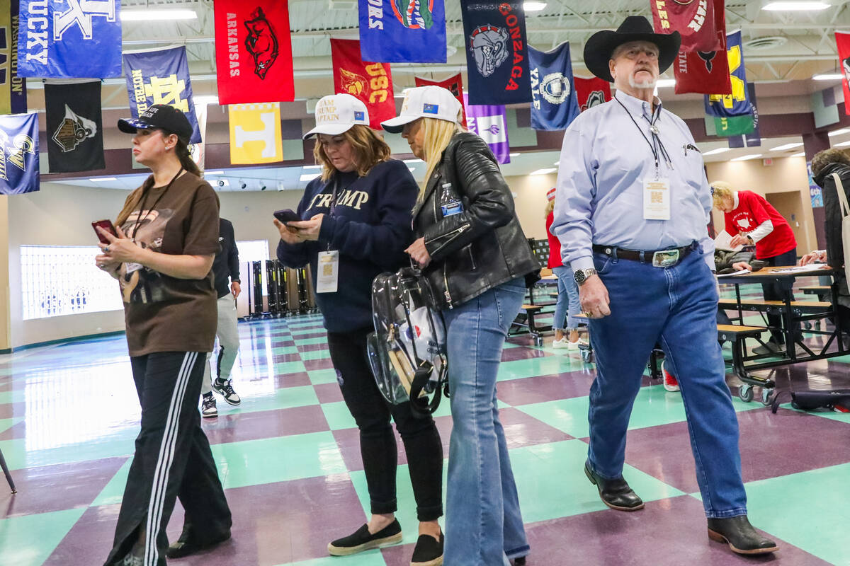 Trump Caucus Captains mingle at a caucus center in Summerlin during the Nevada GOP caucus on Th ...