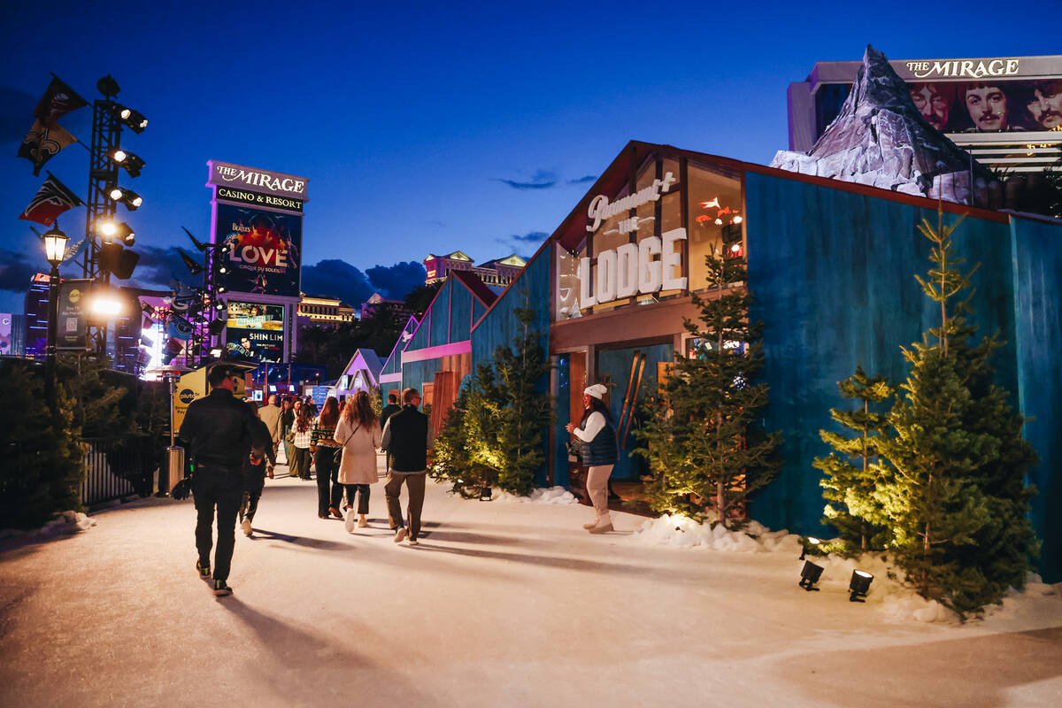 People walk through the Paramount attraction in front of The Mirage on Wednesday, Feb. 7, 2024, ...