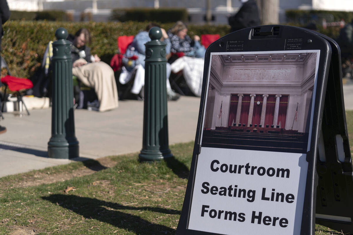 People wait in line outside of the U.S. Supreme Court Wednesday, Feb. 7, 2024, in Washington, t ...