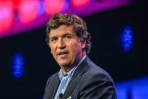 US conservative political commentator Tucker Carlson speaks at the Turning Point Action USA con ...