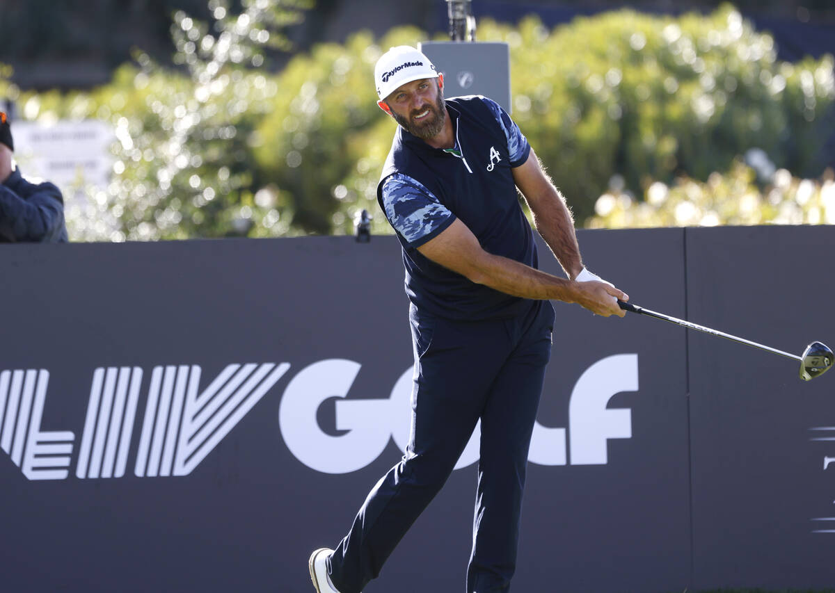 Dustin Johnson of team Aces GC watches his drive off the tee during the first round of LIV Golf ...