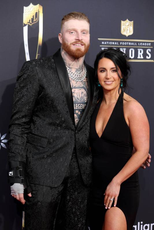 Las Vegas Raiders defensive end Maxx Crosby and his wife, Rachel Washburn, pose on the red carp ...