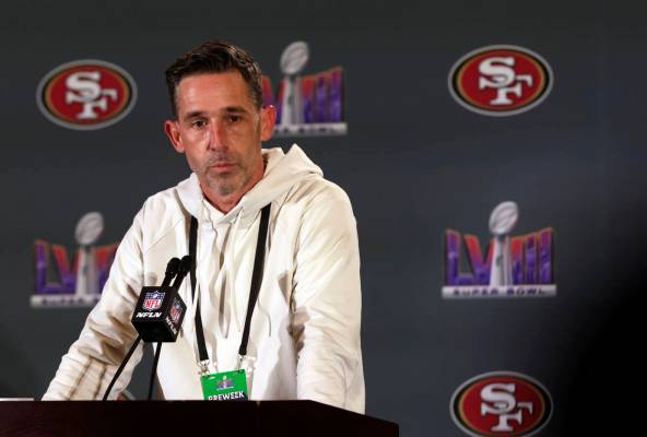 San Francisco 49ers head coach Kyle Shanahan listens to a reporter's question during a news con ...
