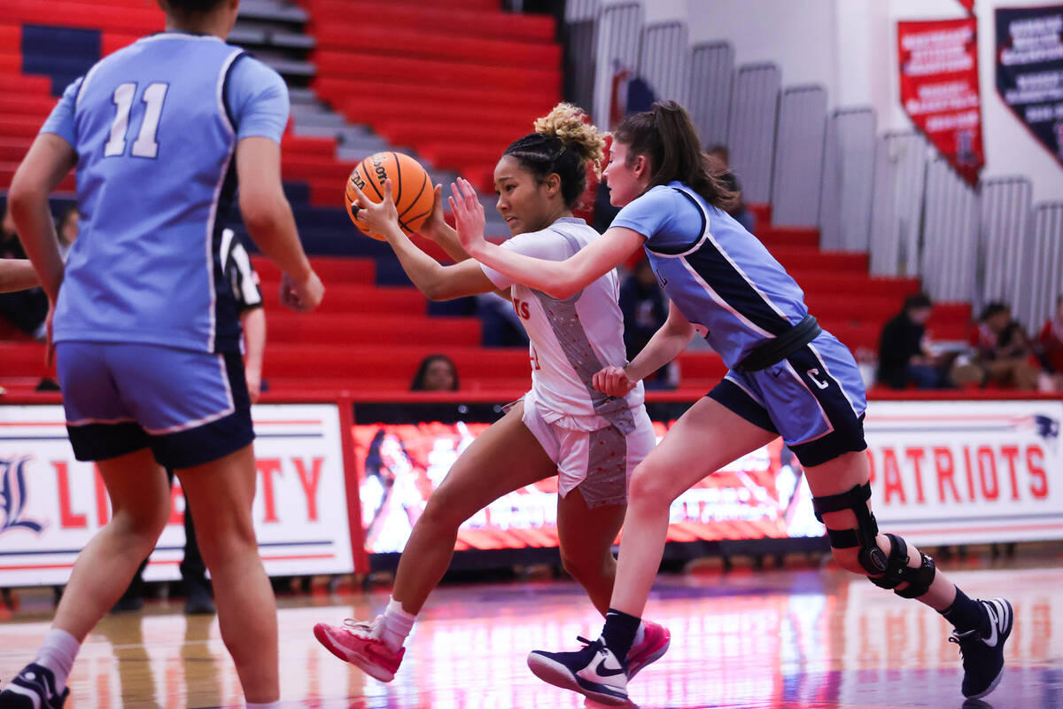 Liberty’s Satsuki Bradley (4) moves the ball around Centennial’s Trysta Barrett ( ...