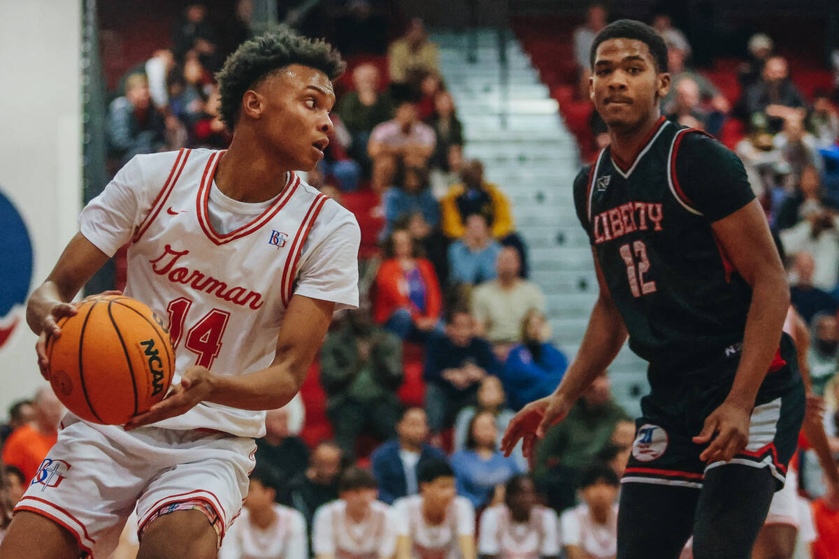 Bishop Gorman’s Kameron Cooper (14) grabs the ball after Liberty made a basket during a ...