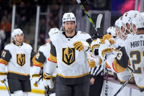 Vegas Golden Knights defenseman Nicolas Hague (14) is congratulated after scoring against the A ...