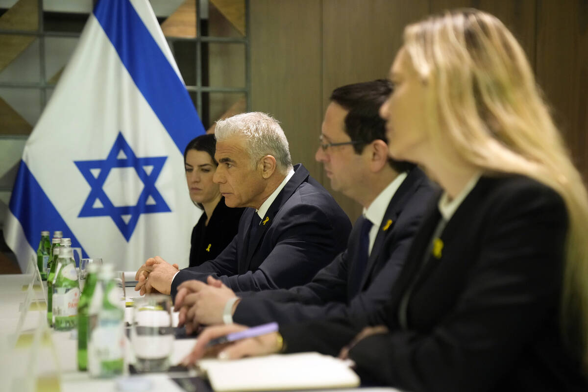 Israeli opposition leader Yair Lapid, centre left, meets with U.S. Secretary of State Antony Bl ...