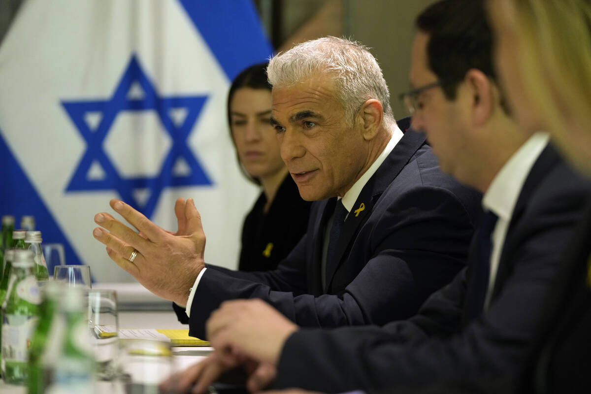 Israeli opposition leader Yair Lapid, centre left, meets with U.S. Secretary of State Antony Bl ...