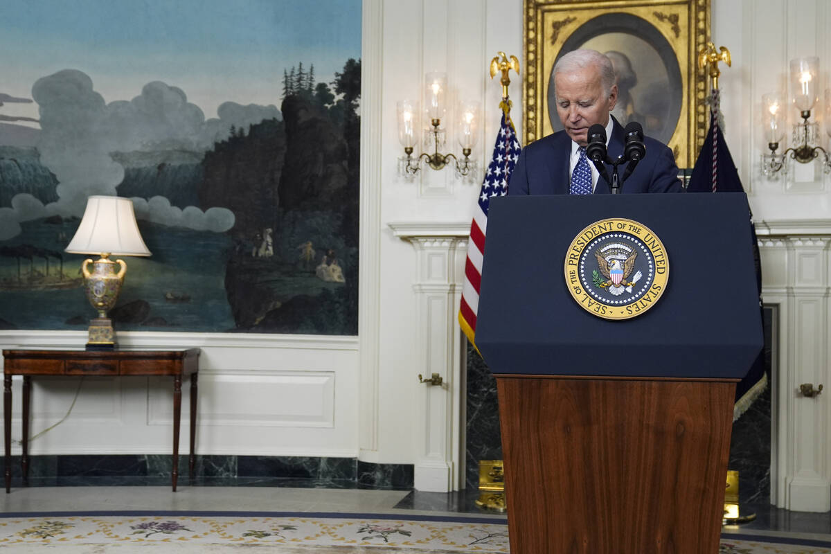 President Joe Biden pauses as he arrives to speak in the Diplomatic Reception Room of the White ...