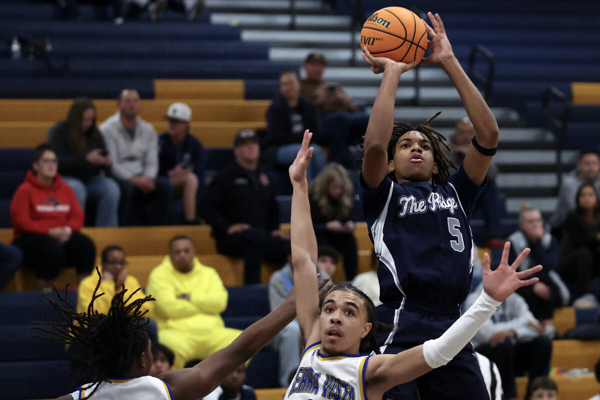 Shadow Ridge guard Jalen Butler (5) shoots against Sierra Vista guard Khamari Taylor (3) during ...