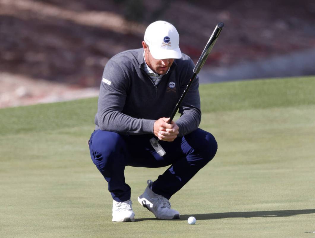 Bryson Dechambeau of team Crushers GC surveys the green on the 9th green during the second roun ...