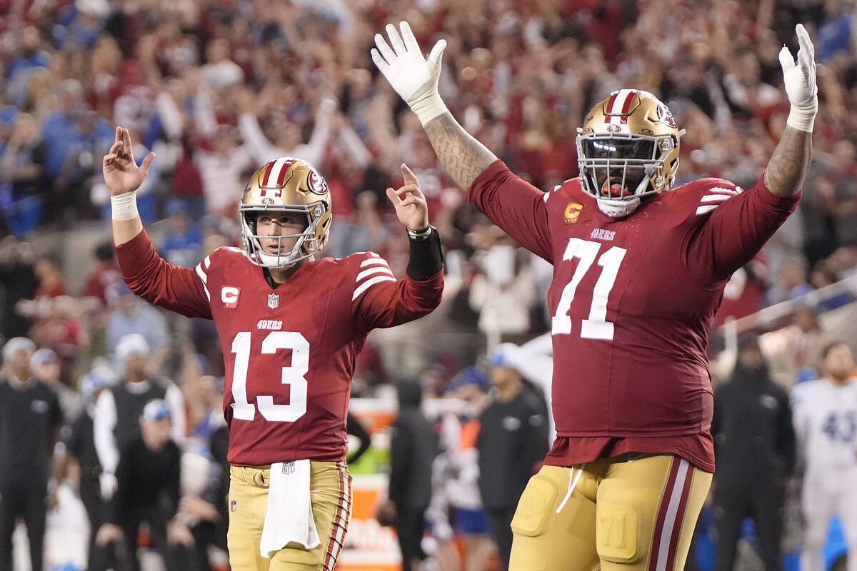 San Francisco 49ers quarterback Brock Purdy (13) and offensive tackle Trent Williams (71) celeb ...