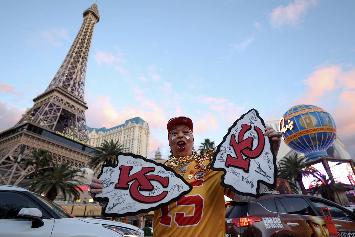 Las Vegan Tammy Allen, a Kansas City Chiefs traveling super fan, poses with her signed Chiefs m ...