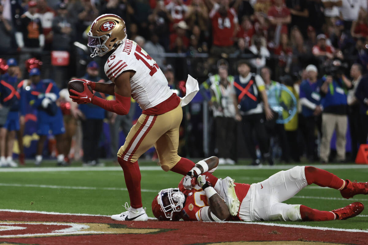 Kansas City Chiefs safety Mike Edwards (21) isn’t able to stop San Francisco 49ers wide recei ...