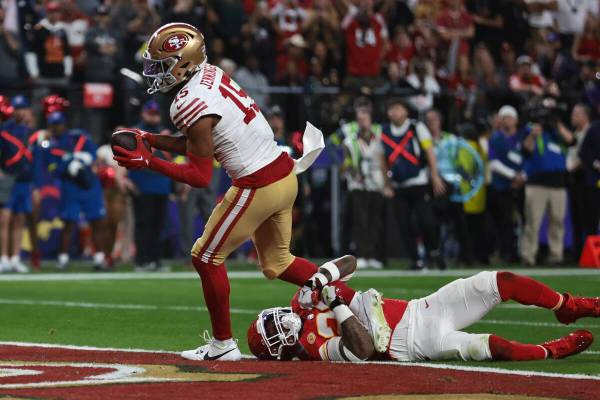 Kansas City Chiefs safety Mike Edwards (21) isn’t able to stop San Francisco 49ers wide recei ...