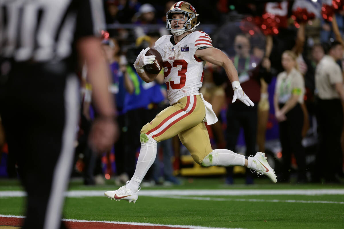 San Francisco 49ers running back Christian McCaffrey (23) runs the ball in for a touchdown agai ...