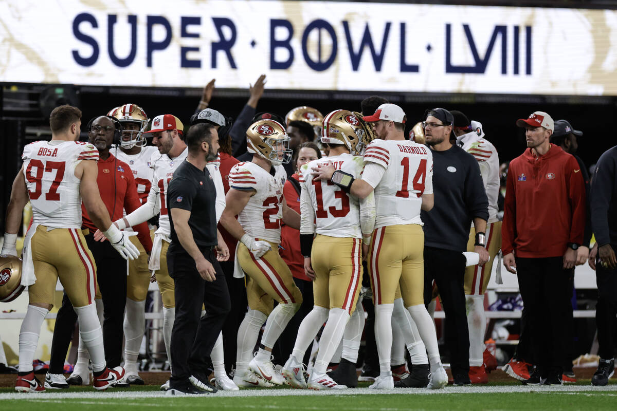 San Francisco 49ers quarterback Brock Purdy (13) is congratulated after their touchdown against ...