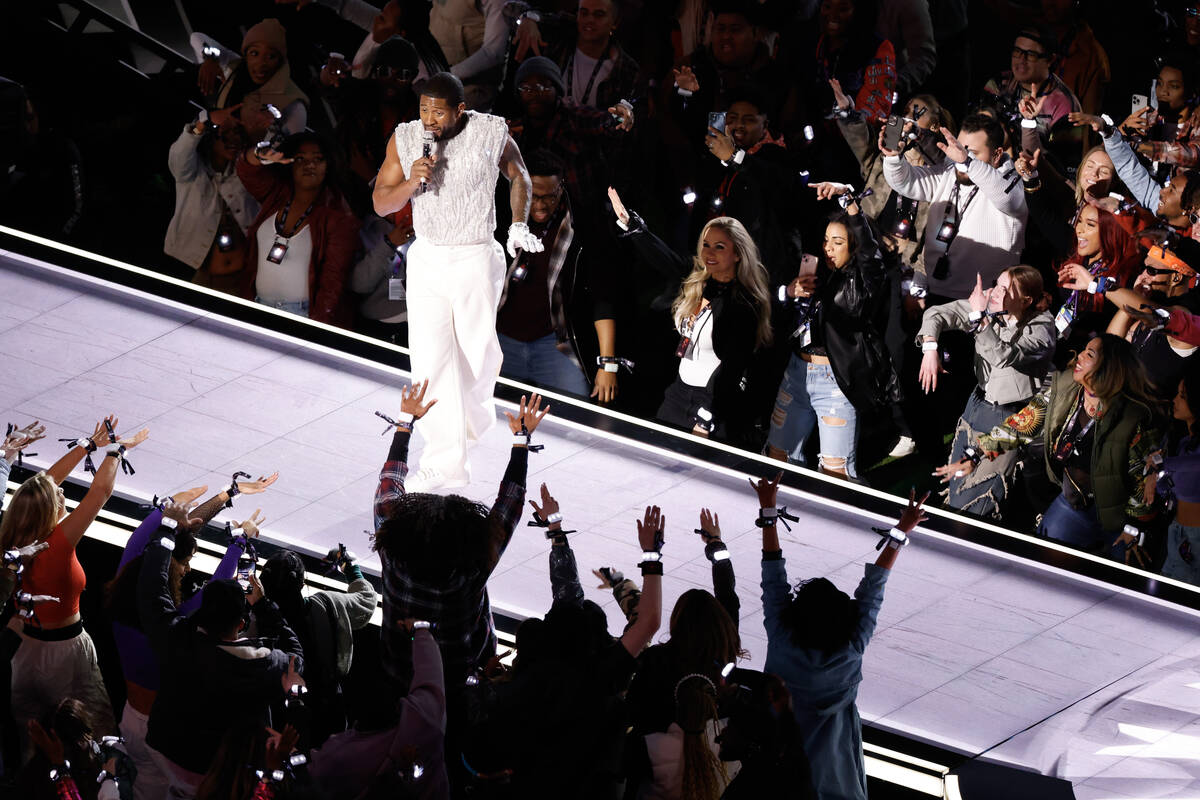 Usher performs during halftime of Super Bowl 58 Sunday, February 11, 2024, at Allegiant Stadium ...