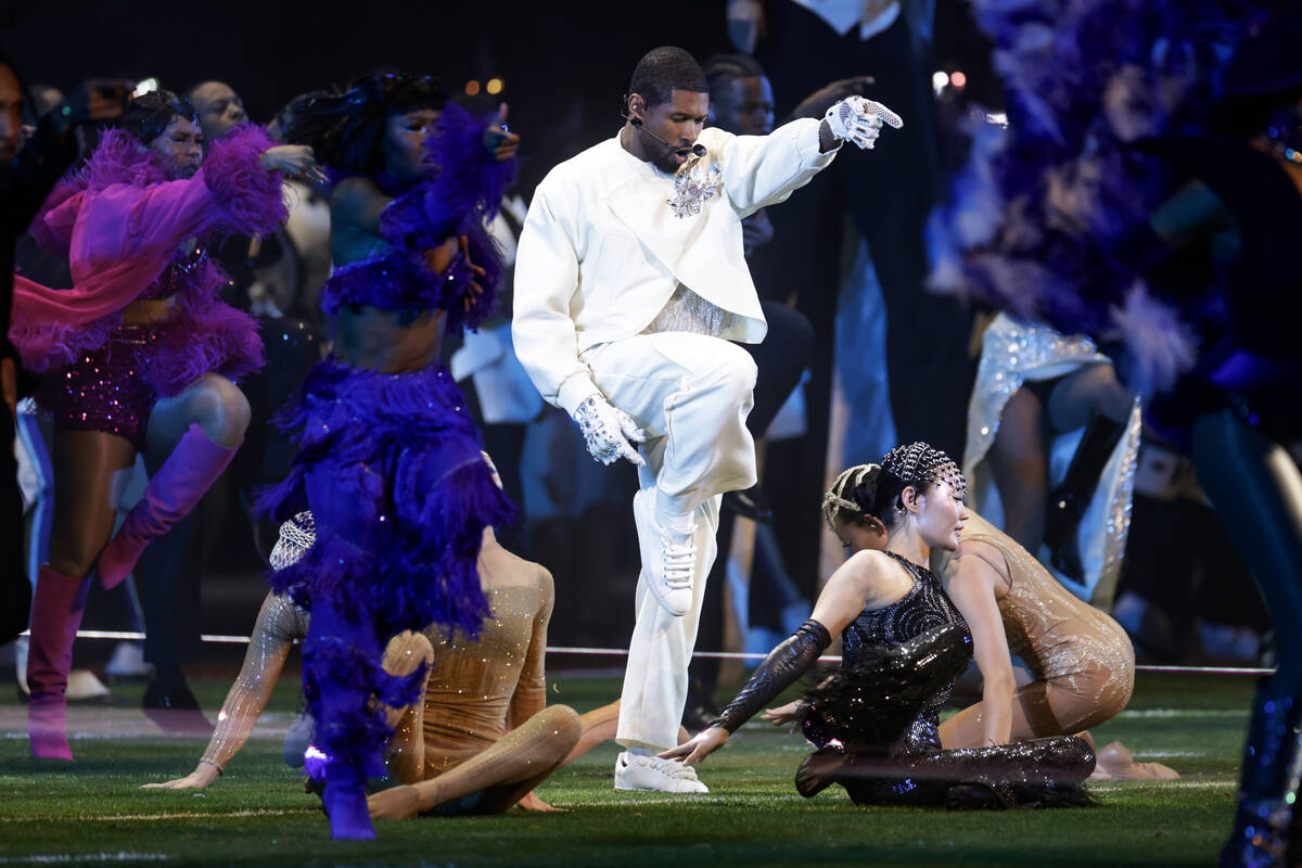 Usher performs during halftime of Super Bowl 58 Sunday, February 11, 2024, at Allegiant Stadiu ...