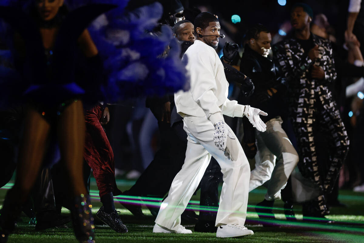 Usher performs during halftime of Super Bowl 58 Sunday, February 11, 2024, at Allegiant Stadiu ...