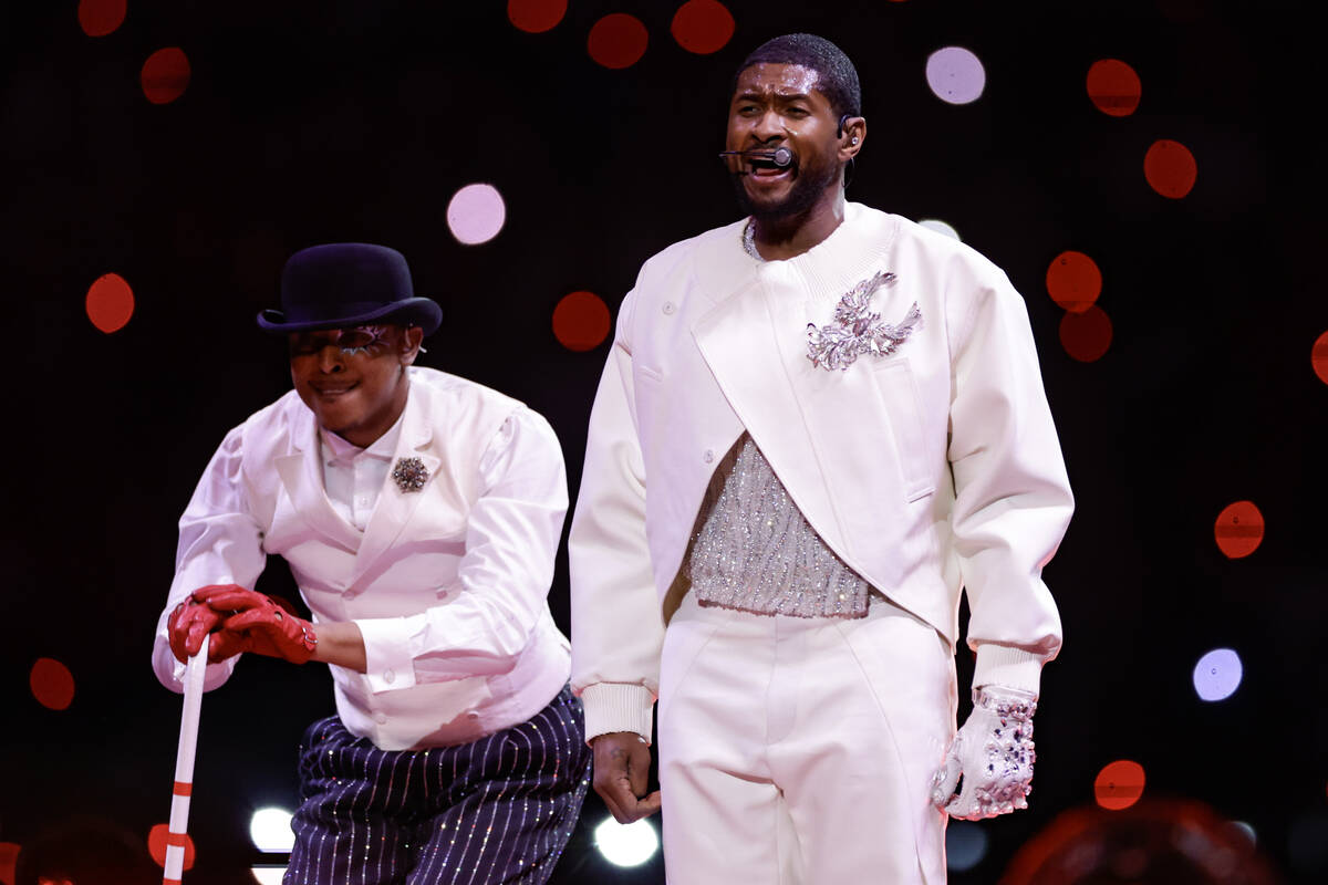 Usher performs during halftime of Super Bowl 58 Sunday, February 11, 2024, at Allegiant Stadiu ...