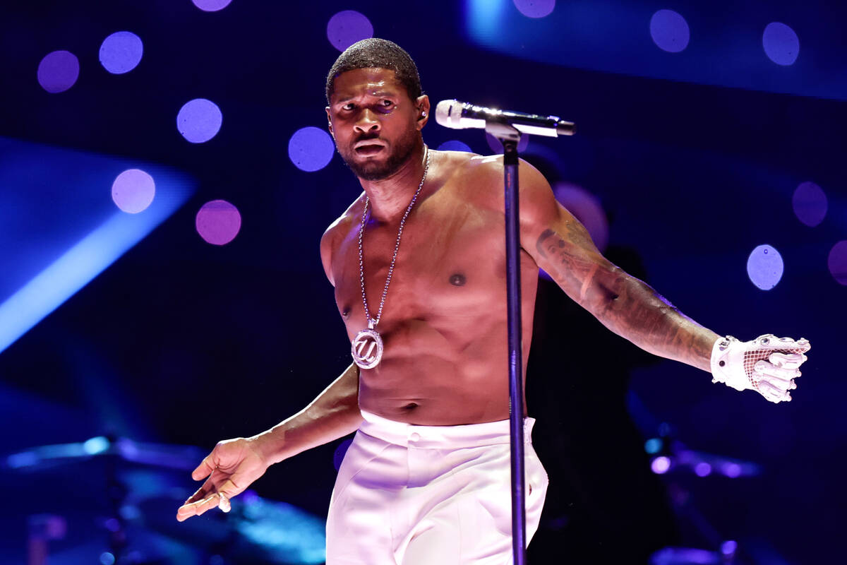 Usher performs during halftime of Super Bowl 58 Sunday, February 11, 2024, at Allegiant Stadiu ...