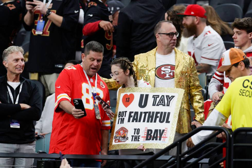 A Taylor Swift fan in the stands holds up a sign before Super Bowl 58 at Allegiant Stadium on S ...