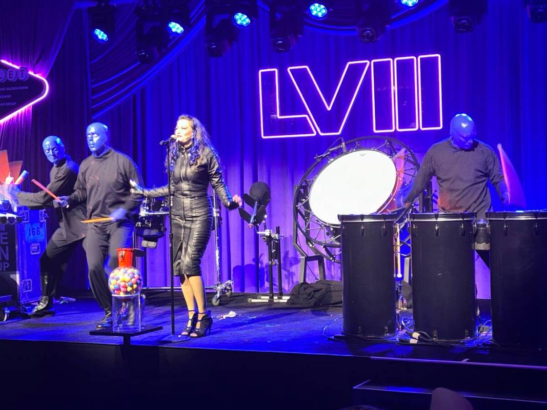 Blue Man Group and Vegas singer Carol-Lyn Liddle perform at the Super Bowl weekend Commissioner ...