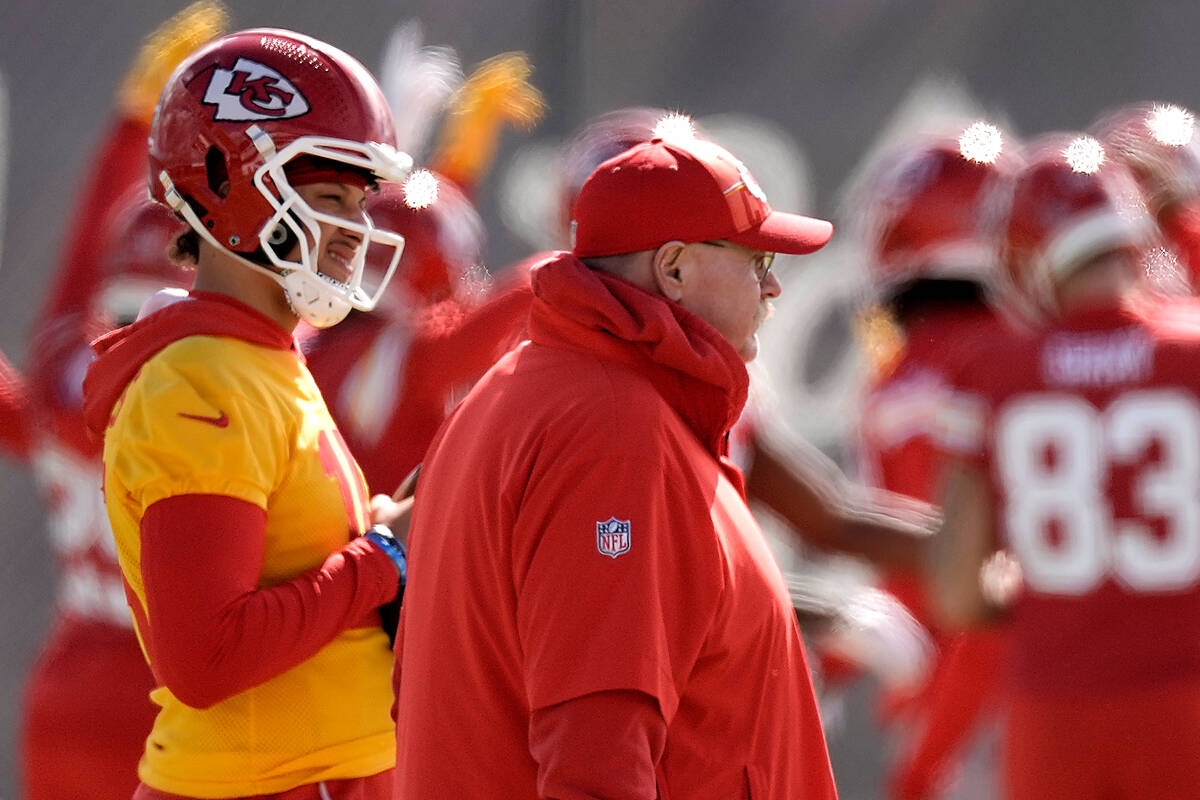 Kansas City Chiefs quarterback Patrick Mahomes, right, and head coach Andy Reid watch practice ...