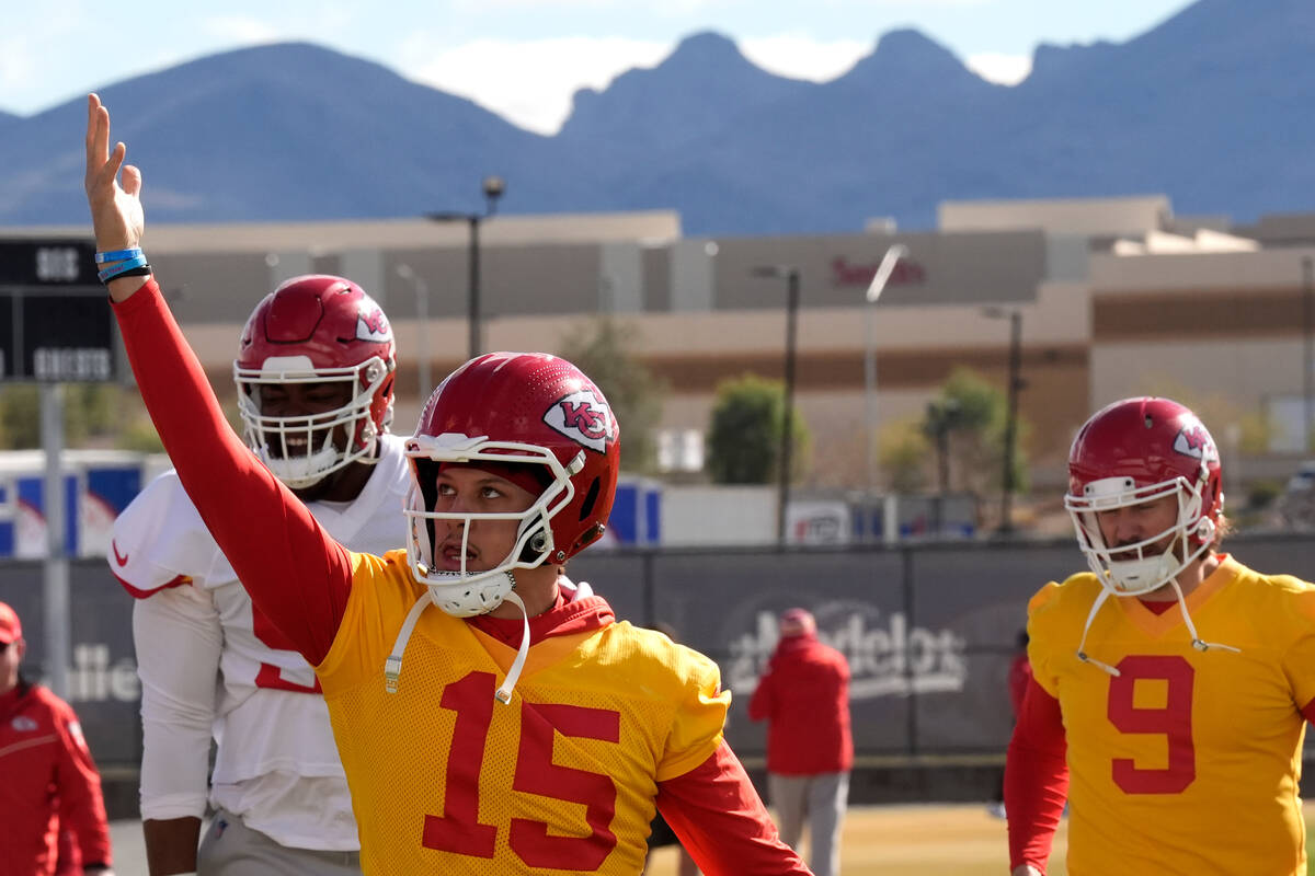 Kansas City Chiefs quarterback Patrick Mahomes (15) stretches during practice for Super Bowl 58 ...