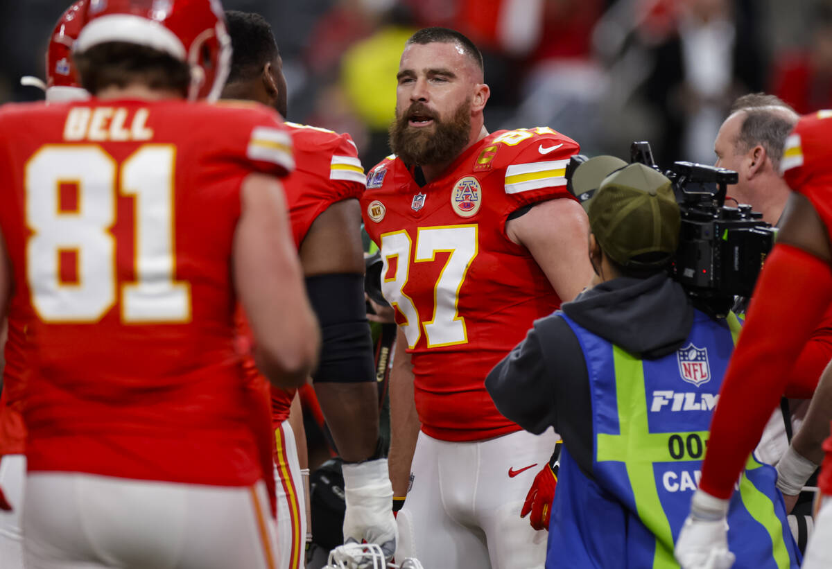 Kansas City Chiefs tight end Travis Kelce (87) talks with teammates before the start of Super B ...