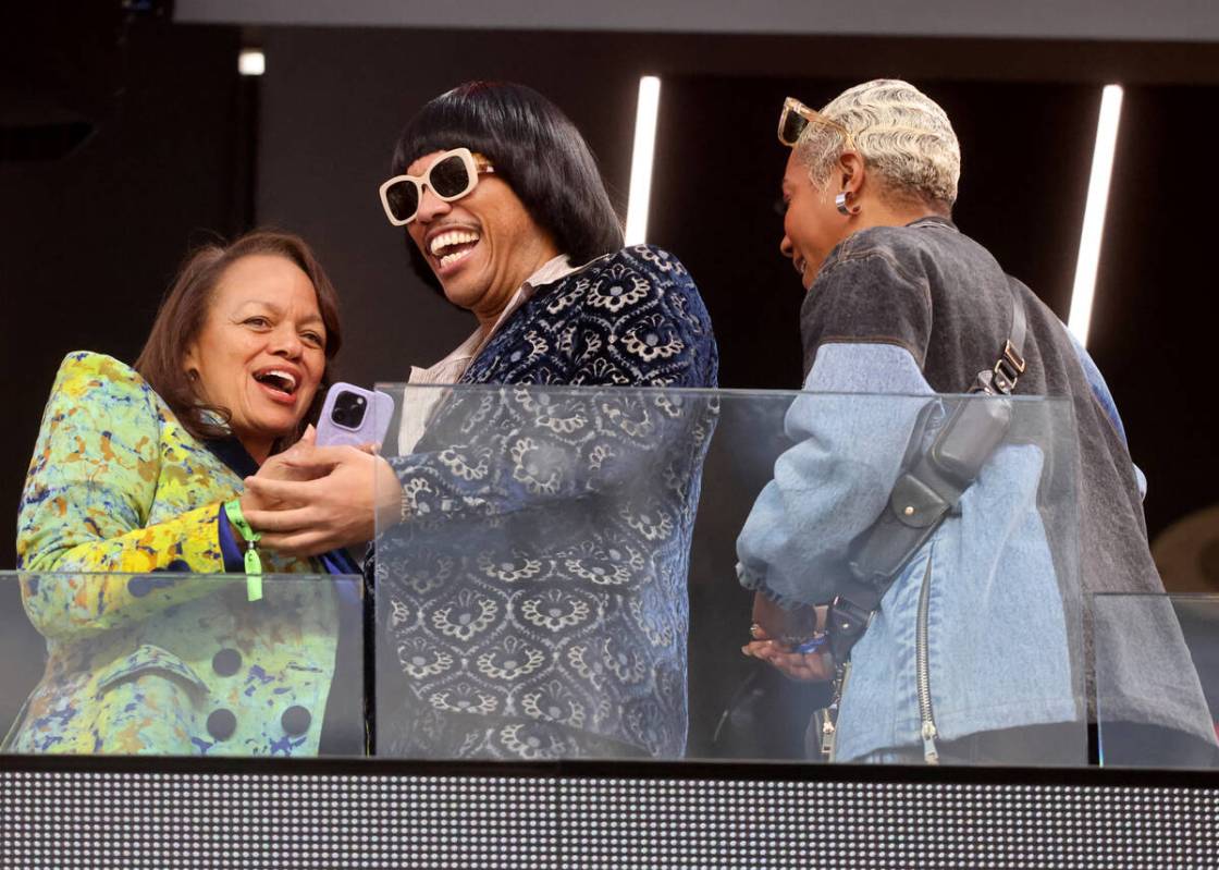 Anderson .Paak, center, and Tiffany Haddish, right, watch as the 49ers take on the Chief in the ...