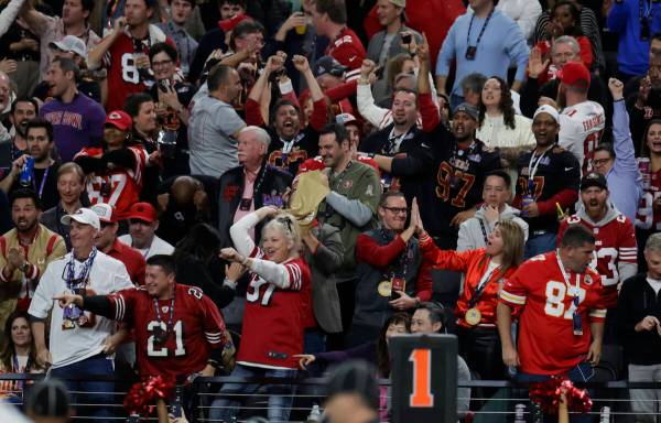 Fans cheer during the first half of Super Bowl 58 at Allegiant Stadium on Sunday, Feb. 11, 2024 ...