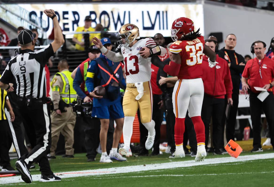 San Francisco 49ers quarterback Brock Purdy (13) gets forced out of bounds by Kansas City Chief ...