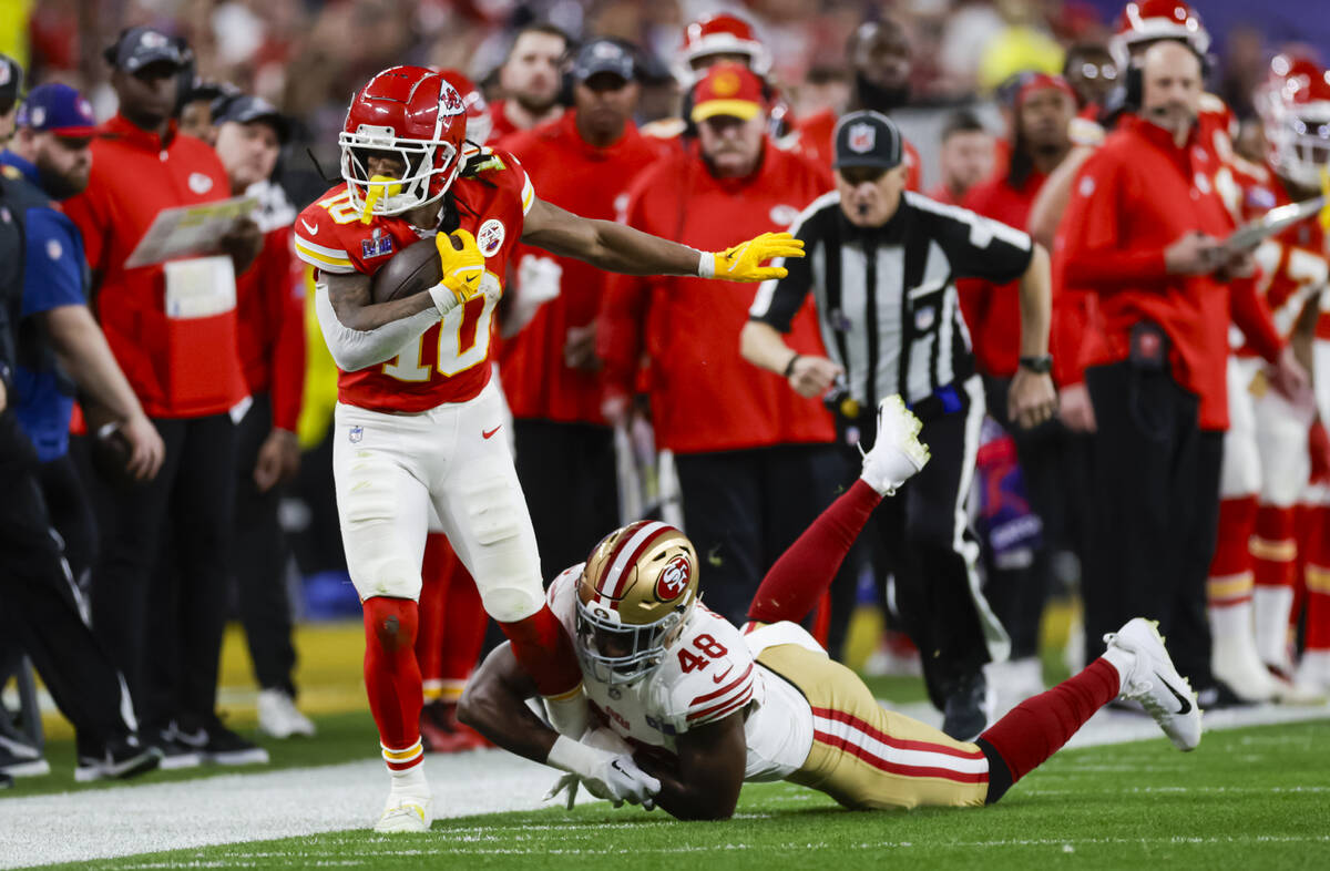 Kansas City Chiefs running back Isiah Pacheco (10) gets forced out of bounds by San Francisco 4 ...