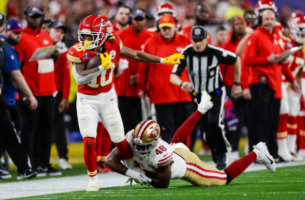 Kansas City Chiefs running back Isiah Pacheco (10) gets forced out of bounds by San Francisco 4 ...