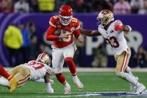 Kansas City Chiefs quarterback Patrick Mahomes (15) runs the ball as San Francisco 49ers safety ...