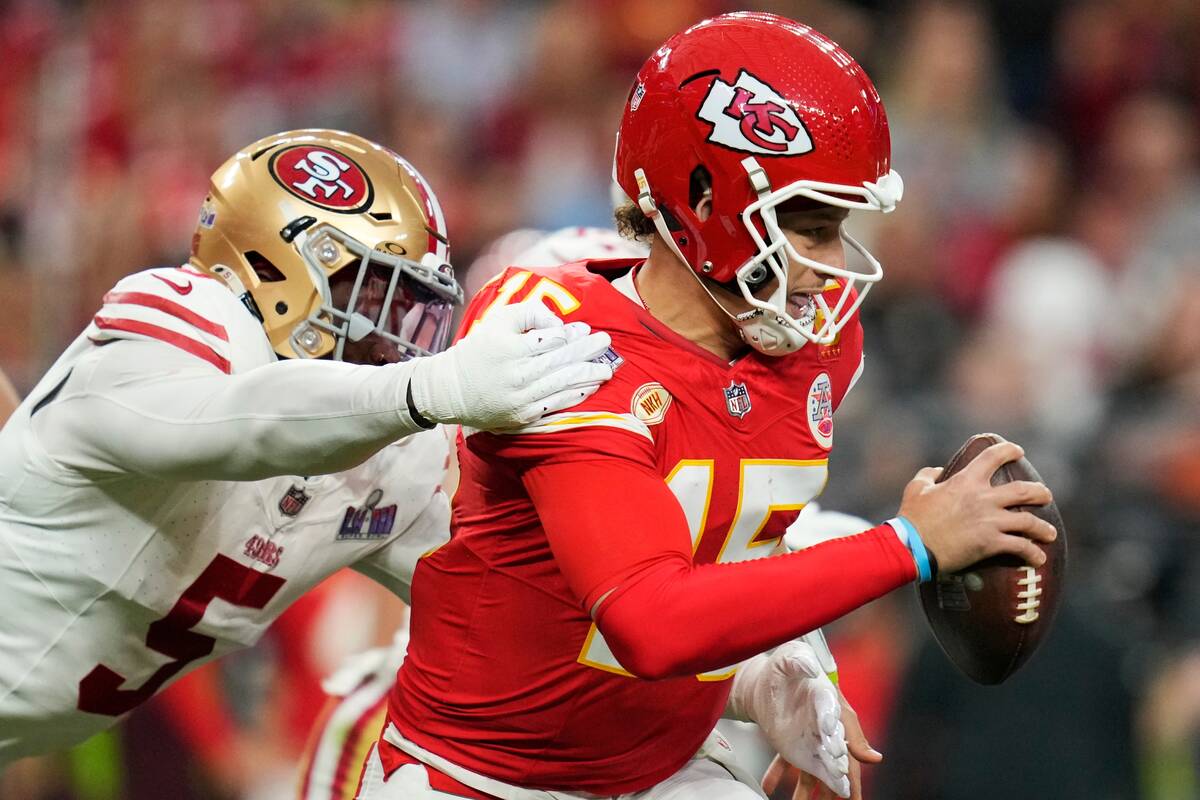 San Francisco 49ers linebacker Randy Gregory (5) hits Kansas City Chiefs quarterback Patrick Ma ...